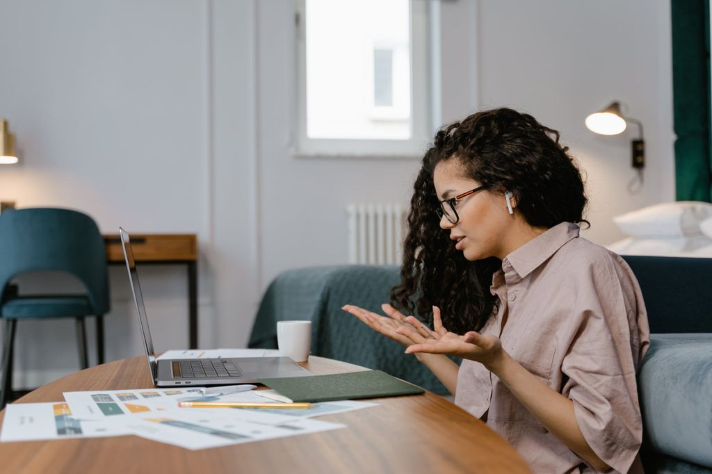 person woman desk laptop