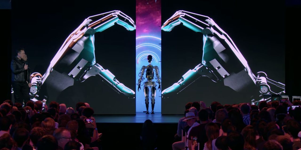 elon-musk-unveils-prototype-of-tesla’s-humanoid-robot-optimus,-says-it-will-cost-less-than-a-car
