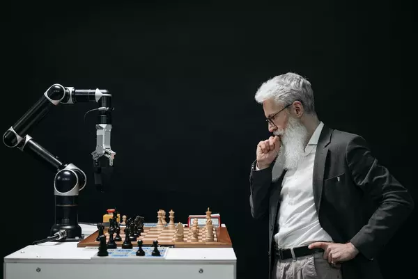 Chess robot being tested by a senior director at Innovatech Solutions.
