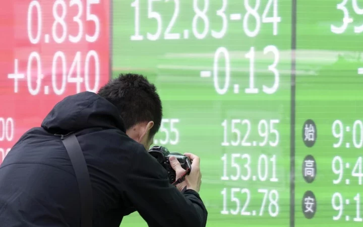 Navigating the Choppy Waters: Asian Shares React to Hot US Inflation Data
